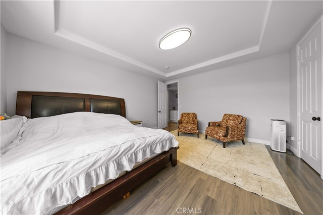 24288 Highcrest Dr, Diamond Bar, CA 91765 - bedroom with baseboards, a tray ceiling, and dark wood-style floors