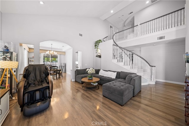 24288 Highcrest Dr, Diamond Bar, CA 91765 - living room with stairway, visible vents, high vaulted ceiling, and an inviting chandelier