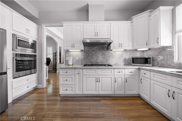 24288 Highcrest Dr, Diamond Bar, CA 91765 - kitchen with white cabinets, backsplash, wall chimney exhaust hood, and appliances with stainless steel finishes