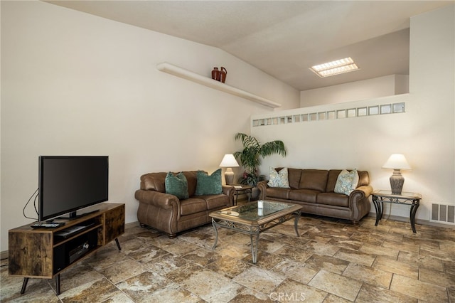 46375 Ryway Pl Unit 2, Palm Desert, CA 92260 - living area featuring stone tile floors and vaulted ceiling