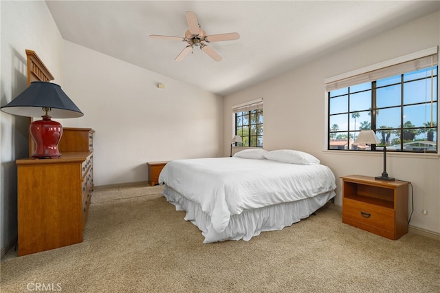 46375 Ryway Pl Unit 2, Palm Desert, CA 92260 - bedroom featuring light colored carpet, vaulted ceiling, and ceiling fan