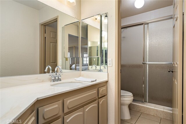 46375 Ryway Pl Unit 2, Palm Desert, CA 92260 - full bathroom featuring vanity, a stall shower, and tile patterned flooring