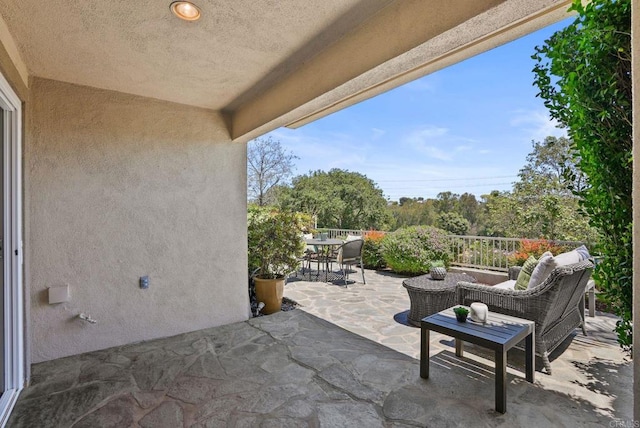 view of patio featuring outdoor dining space and an outdoor living space
