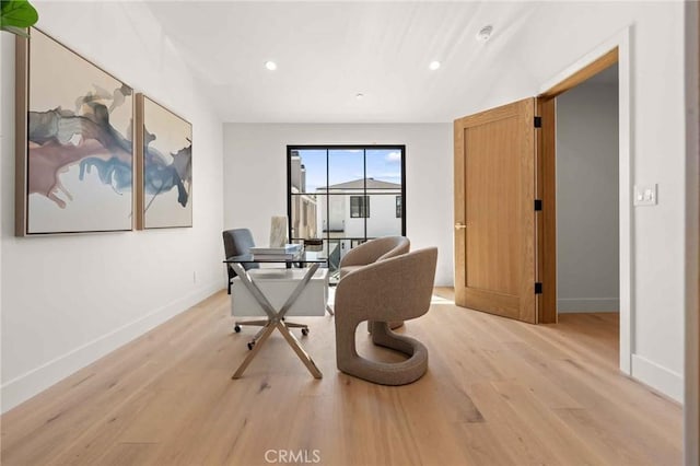 office space with light wood-style floors, baseboards, and recessed lighting