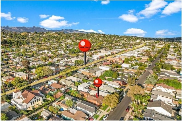 drone / aerial view featuring a mountain view and a residential view