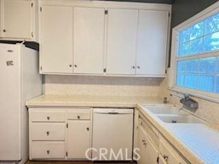 17838-17840 Los Alimos St, Granada Hills, CA 91344 - kitchen with white appliances, light countertops, and white cabinets