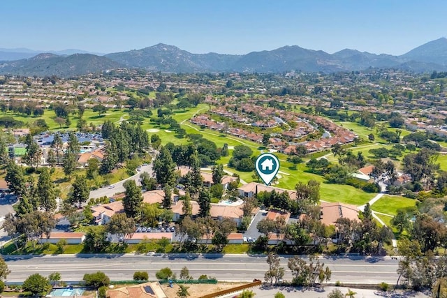 aerial overview of property's location with mountains and nearby suburban area