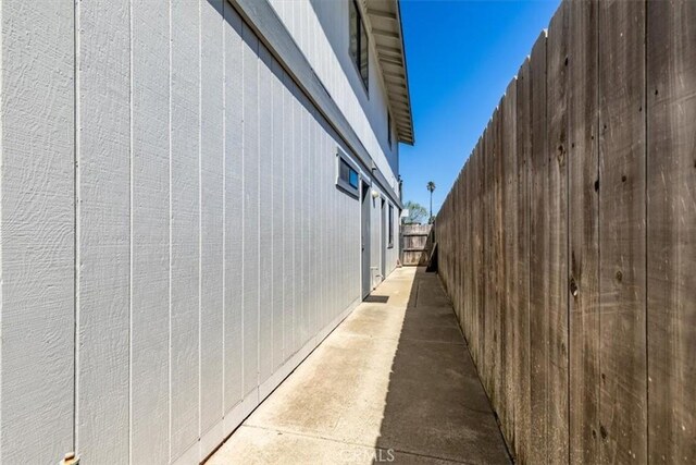 view of property exterior featuring fence