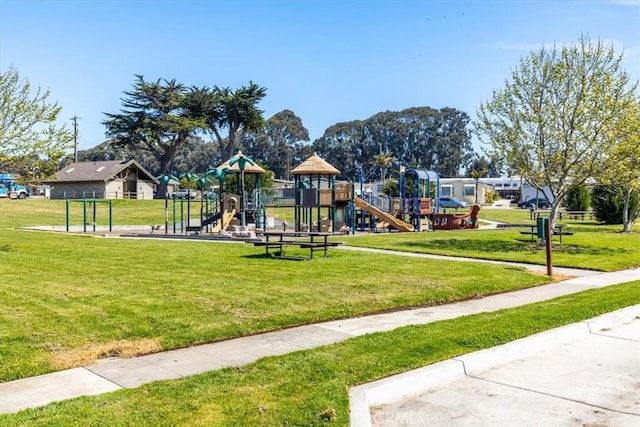 community play area featuring a lawn