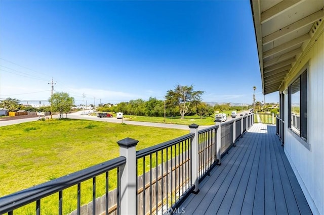 wooden deck with a yard