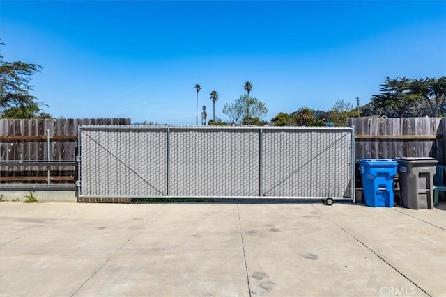view of gate with fence