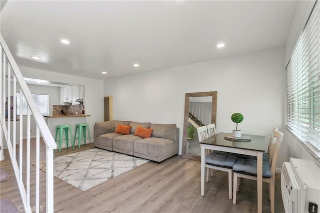 5593 Pioneer Blvd Unit 18, Whittier, CA 90601 - living room featuring stairway, light wood-type flooring, recessed lighting, and a wall unit AC