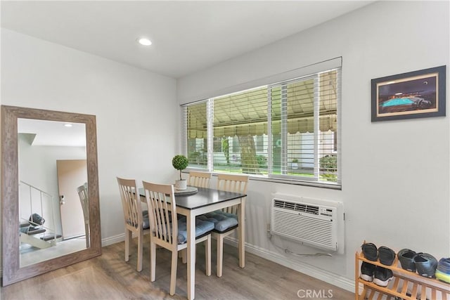 5593 Pioneer Blvd Unit 18, Whittier, CA 90601 - dining area featuring wood finished floors, baseboards, a wall mounted air conditioner, and recessed lighting