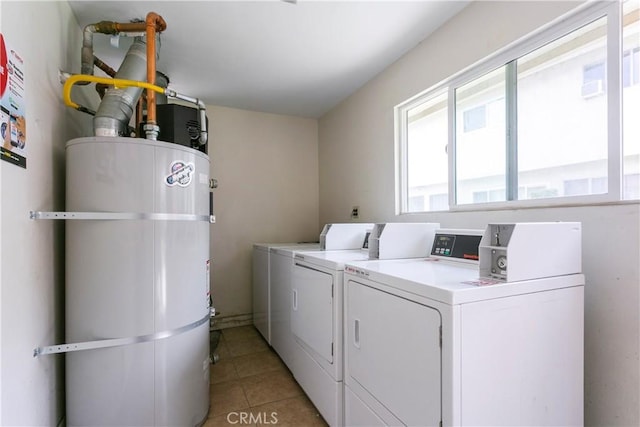 5593 Pioneer Blvd Unit 18, Whittier, CA 90601 - laundry area featuring washer and dryer, water heater, and light tile patterned floors