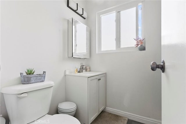 5593 Pioneer Blvd Unit 18, Whittier, CA 90601 - half bath featuring toilet, vanity, and baseboards