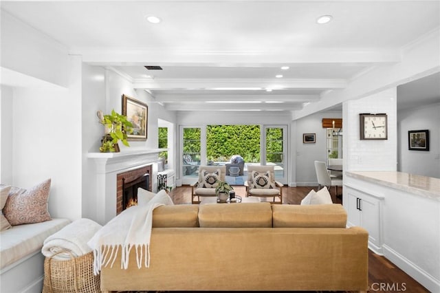 1981 Port Dunleigh Cir, Newport Beach, CA 92660 - living area featuring recessed lighting, dark wood finished floors, visible vents, beam ceiling, and a brick fireplace
