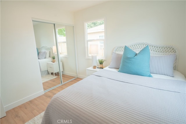 6022 Camerino, Lakewood, CA 90713 - bedroom with light wood-style flooring, baseboards, and a closet