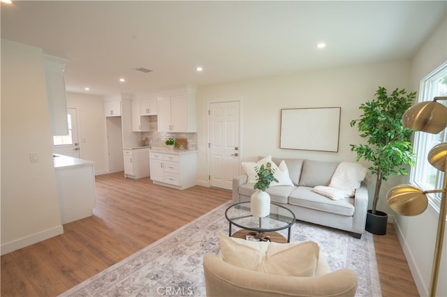 6022 Camerino, Lakewood, CA 90713 - living room with light wood-style flooring, baseboards, and recessed lighting