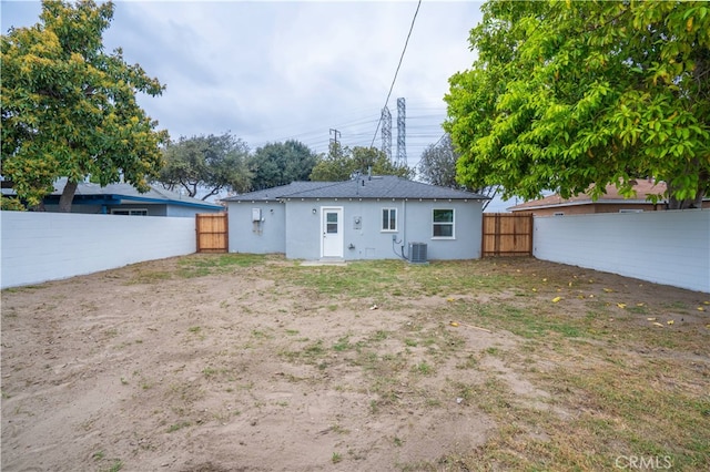 6022 Camerino, Lakewood, CA 90713 - back of house featuring a fenced backyard, central AC unit, and stucco siding