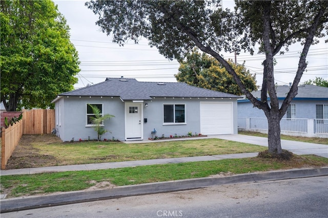 6022 Camerino, Lakewood, CA 90713 - view of front facade featuring stucco siding, a shingled roof, driveway, and an attached garage