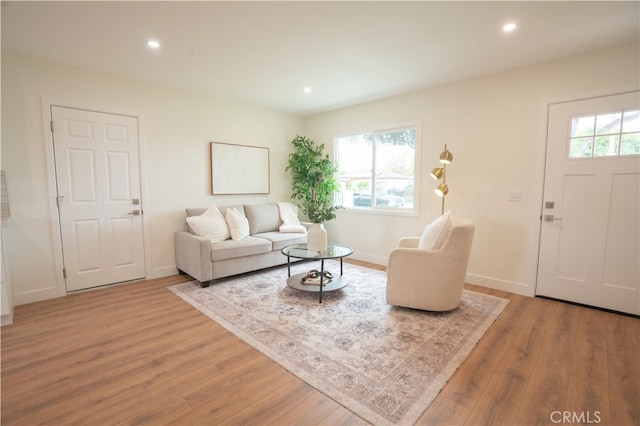 6022 Camerino, Lakewood, CA 90713 - living room with wood finished floors, baseboards, and recessed lighting