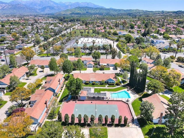 28 Dearborn Cir, Redlands, CA 92374 - aerial view of property and surrounding area with a mountainous background, nearby suburban area, and a pool