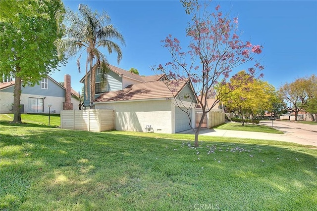 28 Dearborn Cir, Redlands, CA 92374 - view of property exterior featuring driveway, stucco siding, and a garage