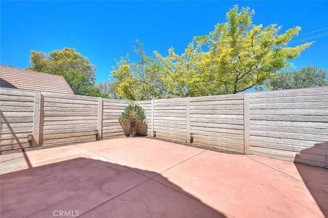 28 Dearborn Cir, Redlands, CA 92374 - fenced backyard with a patio area