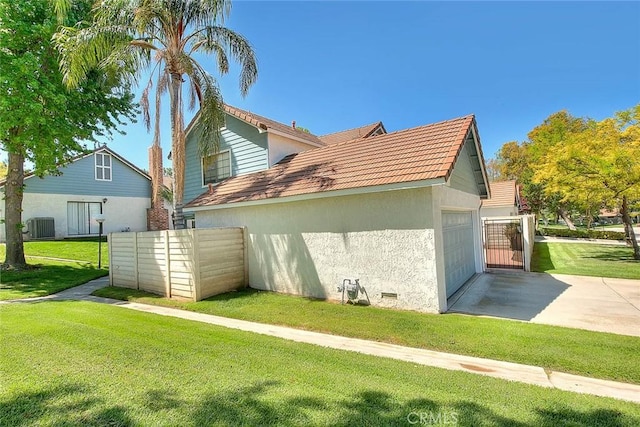 28 Dearborn Cir, Redlands, CA 92374 - view of home's exterior featuring stucco siding, central AC, concrete driveway, and a tiled roof