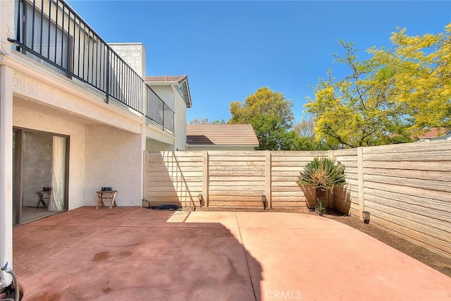 28 Dearborn Cir, Redlands, CA 92374 - fenced backyard with a patio area and a balcony