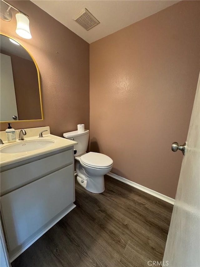 28 Dearborn Cir, Redlands, CA 92374 - bathroom with wood finished floors, vanity, toilet, and baseboards