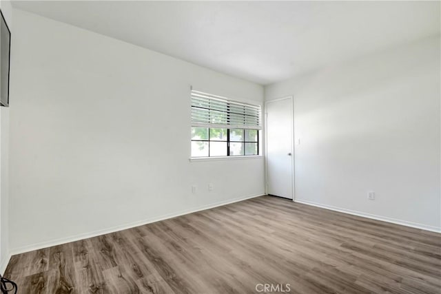 28 Dearborn Cir, Redlands, CA 92374 - unfurnished room with wood finished floors and baseboards