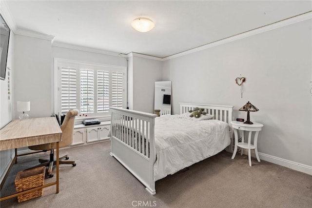 carpeted bedroom featuring baseboards and ornamental molding