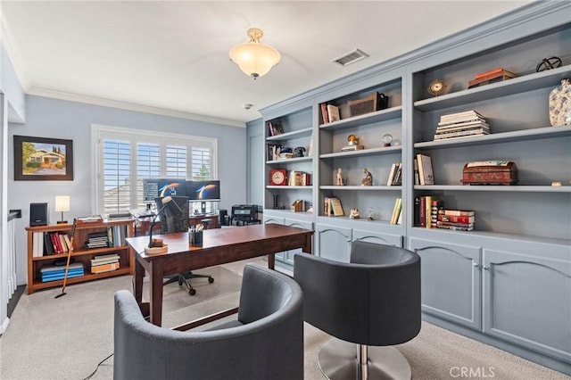 home office with light carpet, ornamental molding, and visible vents