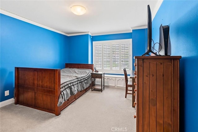 bedroom with carpet floors and crown molding