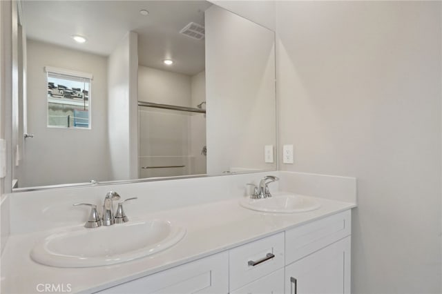 2070 Zest St, Redlands, CA 92374 - bathroom featuring an enclosed shower, double vanity, and recessed lighting
