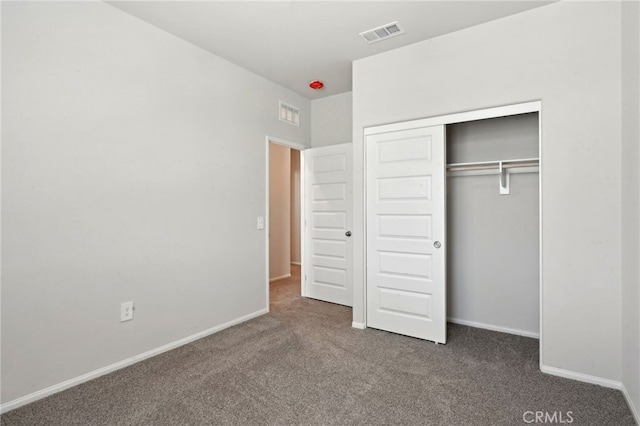 2070 Zest St, Redlands, CA 92374 - unfurnished bedroom featuring dark carpet, a closet, and baseboards