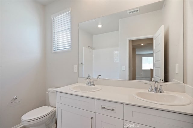 2070 Zest St, Redlands, CA 92374 - bathroom featuring toilet, a shower, and double vanity