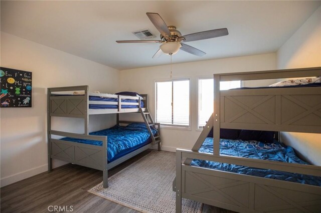 73640 Joshua Tree St, Palm Desert, CA 92260 - bedroom featuring wood finished floors, baseboards, a ceiling fan, and multiple windows