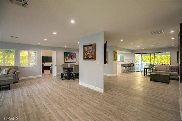 73640 Joshua Tree St, Palm Desert, CA 92260 - living room featuring baseboards, visible vents, and recessed lighting