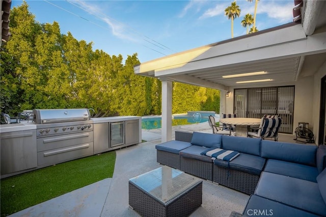 73640 Joshua Tree St, Palm Desert, CA 92260 - view of patio / terrace featuring area for grilling, exterior kitchen, an outdoor pool, an outdoor hangout area, and outdoor dining space