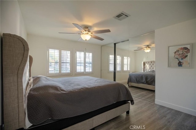 73640 Joshua Tree St, Palm Desert, CA 92260 - bedroom with baseboards, a ceiling fan, wood finished floors, and visible vents