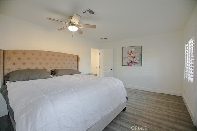73640 Joshua Tree St, Palm Desert, CA 92260 - bedroom featuring ceiling fan, baseboards, wood finished floors, and visible vents