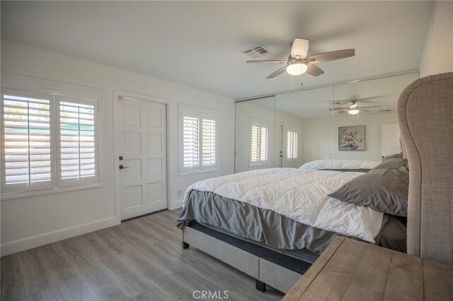 73640 Joshua Tree St, Palm Desert, CA 92260 - bedroom with baseboards, wood finished floors, visible vents, and a ceiling fan