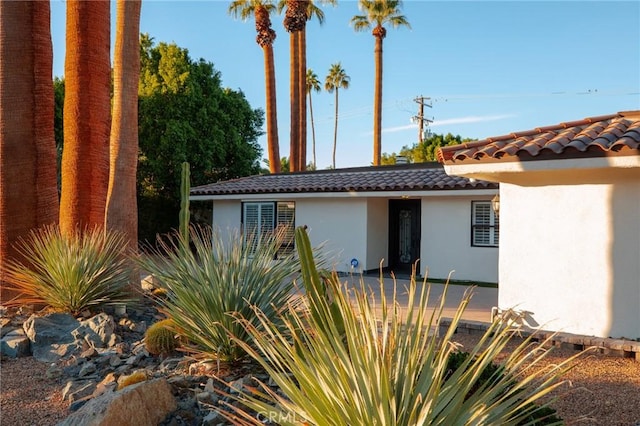 73640 Joshua Tree St, Palm Desert, CA 92260 - view of front of house featuring a tiled roof and stucco siding