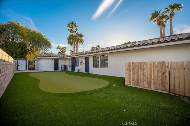 73640 Joshua Tree St, Palm Desert, CA 92260 - back of property featuring fence private yard, a storage unit, central AC, and stucco siding