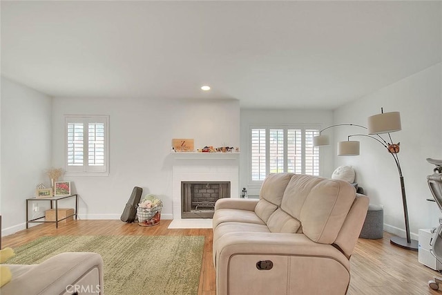 686 E Workman St, Covina, CA 91723 - living area featuring recessed lighting, baseboards, a fireplace with flush hearth, and wood finished floors
