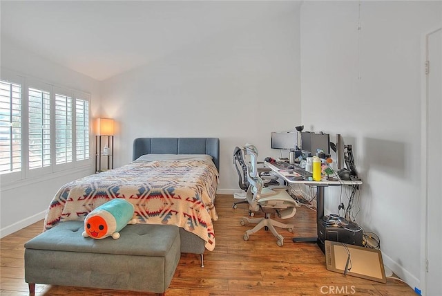 686 E Workman St, Covina, CA 91723 - bedroom with a desk, baseboards, and wood finished floors