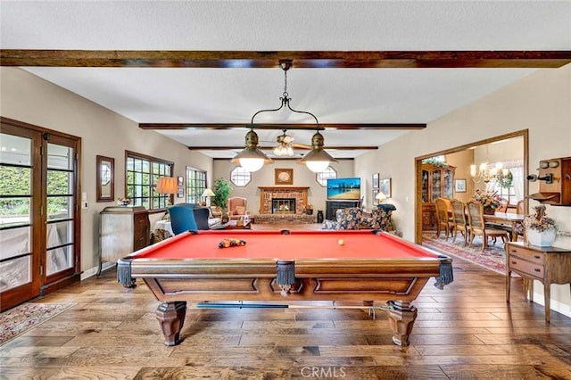 game room featuring beamed ceiling, wood-type flooring, and pool table