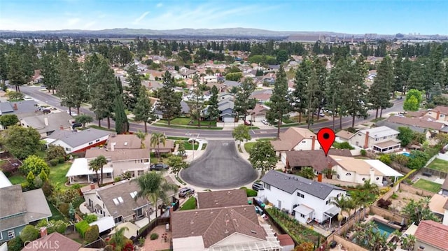 birds eye view of property with a residential view and a mountain view
